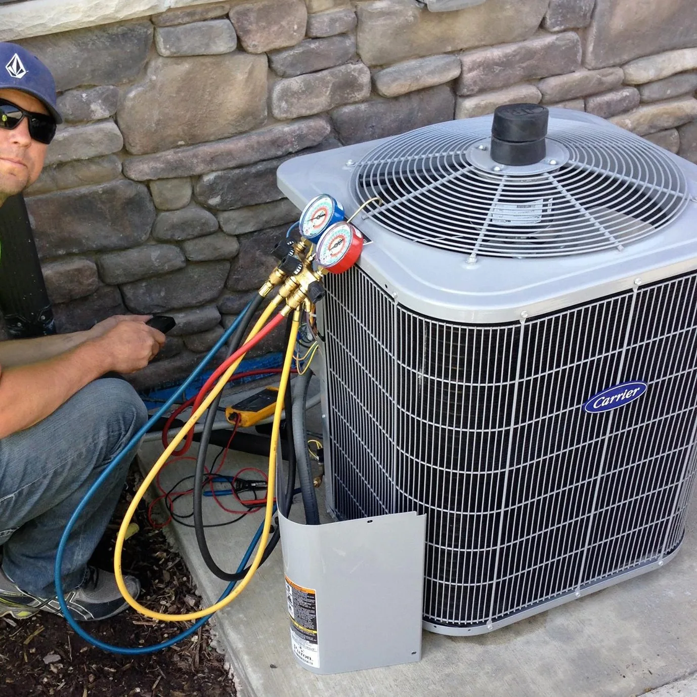 HVAC technician performing an AC tune-up in Utah